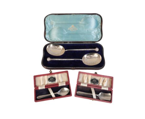 A PAIR OF VICTORIAN SILVER SERVING SPOONSby Martin & Hall, Sheffield 1881, with elaborate gilded bowls and ball finials, 22 c