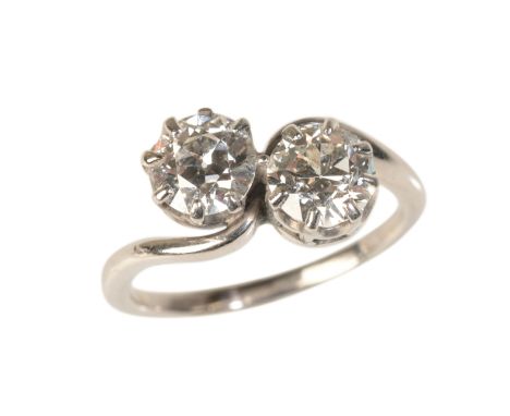 A VINTAGE TOI-ET-MOI DIAMOND RINGin 18ct white gold, set with two old European cut diamonds totalling c.1.55 carats, held in 