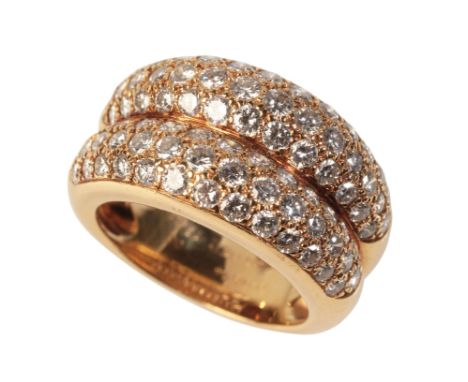 CARTIER: A VINTAGE DIAMOND DRESS RINGin 18ct yellow gold, of double row bombé design, pavé set to the top with round brillian