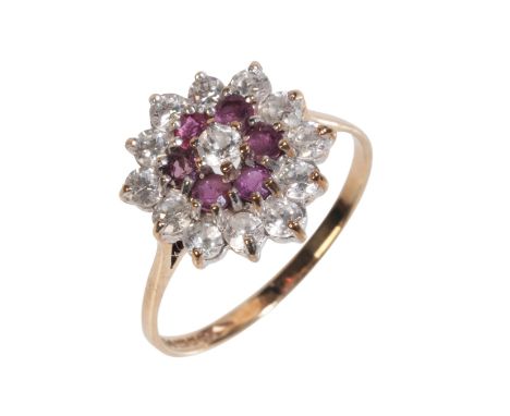 A GLASS-FILLED RUBY AND WHITE GEMSTONE CLUSTER RINGin 9ct gold, set with a cluster of round brilliant cut white gemstones and