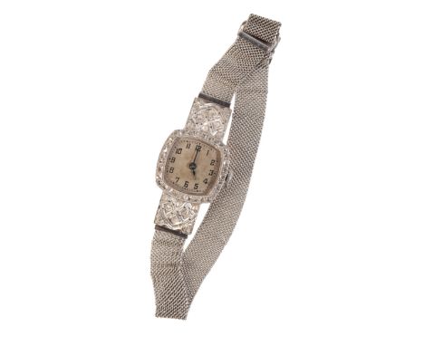 A LADY'S DIAMOND-SET & PLATINUM COCKTAIL WATCHwith manual wind movement, the silver dial with black Arabic numerals and dark 