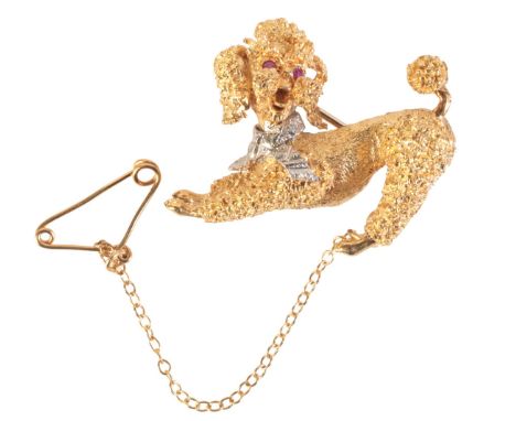 A VINTAGE RUBY AND DIAMOND POODLE BROOCHin 18ct gold, with ruby set eyes and diamond set collar, textured fur, secured with a