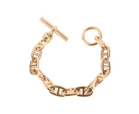HERMÈS: A CHAINE D'ANCRE BRACELET (LARGE MODEL)in 18ct gold, comprising a series of mariner links, secured with a T-bar fitti