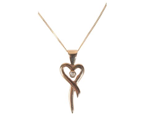 A DIAMOND HEART PENDANT NECKLACEin 9ct gold, the stylised heart set with a single cut diamond to the centre, suspended from a