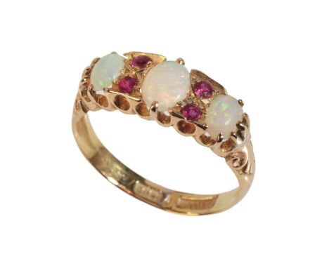 AN ANTIQUE OPAL AND RUBY RINGin 18ct gold, set with three graduated opals, accented by four round cut rubies, stamped 'H.W.LD