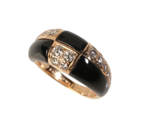 VAN CLEEF & ARPELS: A VINTAGE ONYX AND DIAMOND DRESS RINGin 18ct gold, of chequerboard pattern, set with carved onyx and roun