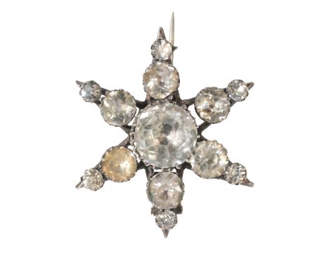 AN ANTIQUE VICTORIAN PASTE STAR BROOCHin sterling silver, set throughout with round cut paste stones, secured with a pin clas