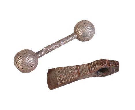 AN OMANI STEEL JERZ AXE HEAD with copper banding and stylised decoration, and an Omani white metal Childs rattle (2)