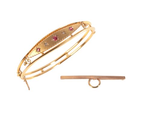 AN ANTIQUE ETRUSCAN REVIVAL RUBY AND DIAMOND BANGLE AND A BAR BROOCHin 9ct gold, the bangle set with round cut rubies and ros