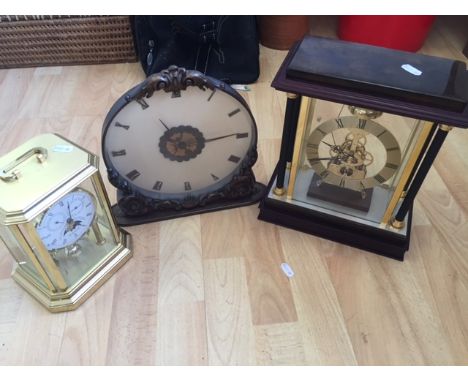A Sewills Anniversary clock to mark their 200th anniversary, a modern skeleton clock in glass and mahogany case, and a large 