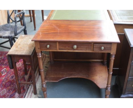 A 20th century mahogany side table with three freize drawers, under shelf and ring turned legs together with a small oak drop