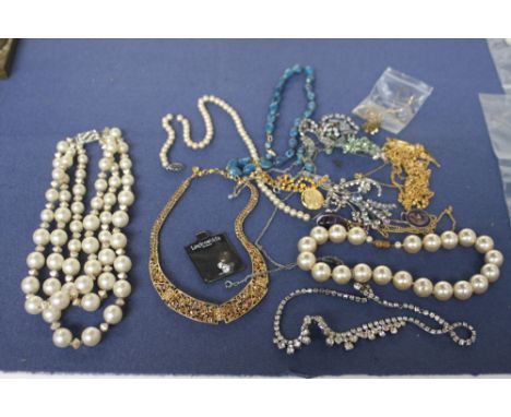 A mixed lot of jewellery including a large imitation pearl bead necklace, a blue stone bead necklace, with brooches