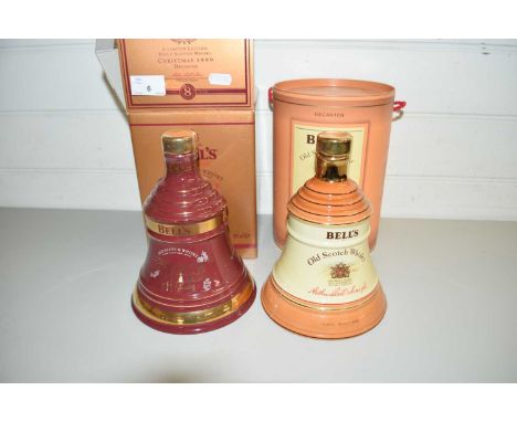 BELLS SCOTCH WHISKY, TWO COMMEMORATIVE WEIGHED BOTTLES, CHRISTMAS 1999 AND ONE OTHER