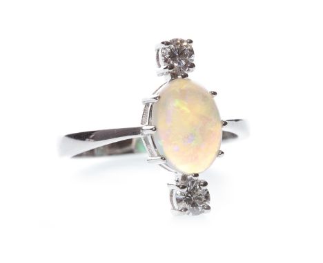 OPAL AND DIAMOND RING, set with a central oval cabochon opal 9.5mm long flanked by two round brilliant cut diamonds totalling