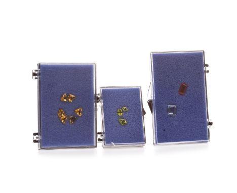 GROUP OF UNMOUNTED GEMS, including citrine, peridot, fire opal and lapis lazuli beads, contained in cases