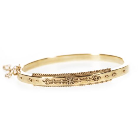 LATE VICTORIAN BANGLE, with floral and ropetwist motif decoration, safety chain, 65mm wide, unmarked