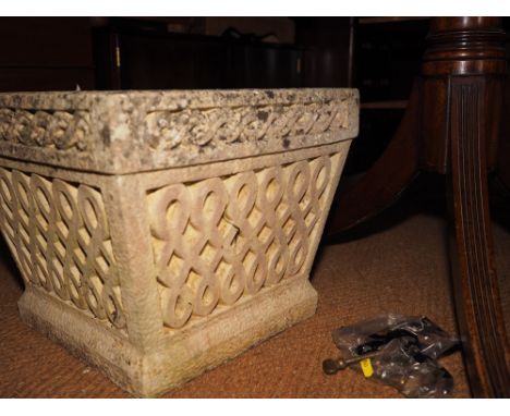 A cast stone planter with scroll design, 16" square 