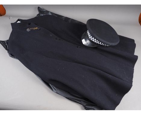 A police officer's woollen cloak, a police officer's jacket and trousers, a hat and a number of Special Constable arm flashes
