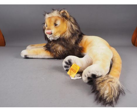 A Steiff 1956 vintage recumbent Leo the Lion soft toy, 24 1/2" long overall