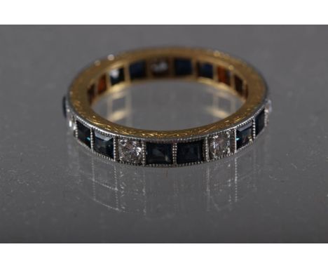 A yellow and white metal eternity ring set diamonds and sapphires, size N, 4g 
