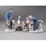 Four Royal Copenhagen figures, girl with a goose (528), girl with calf (779), boy with calf (772),