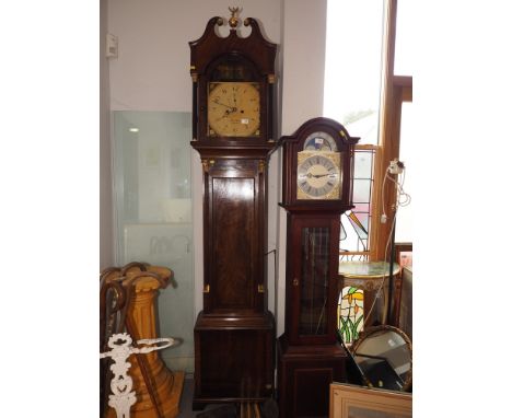 A George III figured mahogany and ebony line inlaid archtop long case clock with painted Adam and Eve top dial, eight-day str