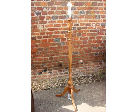 A turned Acacia standard lamp, on tripod splay support 