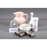 A Clarice Cliff pink glazed jug (cracked handle), three Aynsley animal model groups, three Goebel