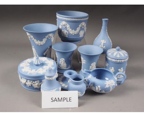 A quantity of Wedgwood light blue jasperware, including a flared rim vase, 6" high, a pair of jars and covers, trinket dishes