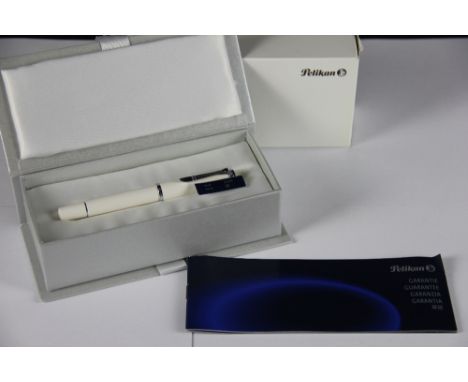 A Pelikan M 20J white fountain pen, uninked, in original box with guarantee and outer box