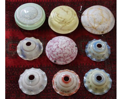 A collection of nine 1950's mottled glass light shades, of varying colour