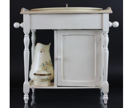 A French nursery wash stand set by Sarreguemines, outside decorated, the ceramic topped panted washstand with towel rails, su