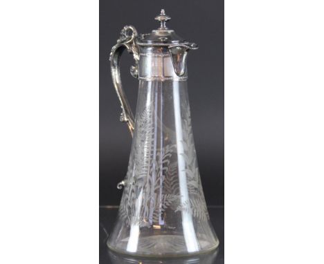 A Victorian silver plated claret jug, the clear glass body engraved with birds and ferns, the silver plated mount with urn fi