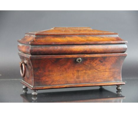 A William IV mahogany tea caddy, sarcophagus form, with two internal canisters, on bun feet, 33cm 