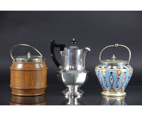 Two silver plated entrée dishes and covers, a Noritake plate mounted biscuit barrel, a plate mounted oak biscuit barrel, two 