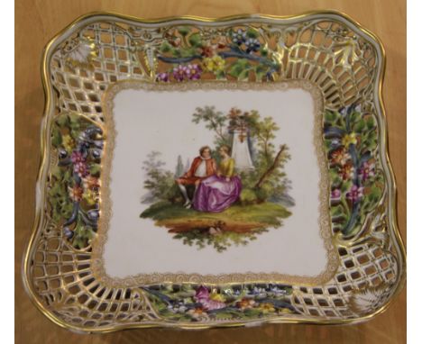 A Dresden porcelain dish, of serpentine square form, with printed and painted decoration and pierced rim, 25cm, with nine Roy