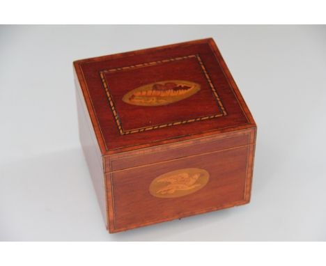 A George III inlaid mahogany tea caddy, with inlaid paterea of a shell and a bird, with internal cover, 10cm x 14cm