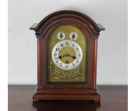 A walnut bracket clock, with Roman numeral chapter ring below silent / strike and regulator  selectors, the movement stamped 