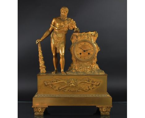 An early 19th century ormolu mantel clock, 11.5cm dial with Roman numerals and matted center, with movement striking on a bel