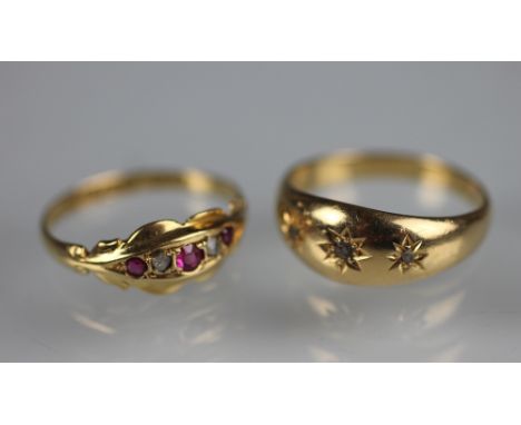 A Victorian 18ct yellow gold and three stone diamond set ring, each diamond within star setting along with a synthetic ruby a