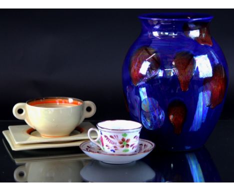 A Clarice Cliff soup bowl, stand and plate, Biarritz shape, with orange and brown rims, a Poole Pottery vase, with iridescent