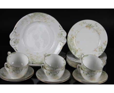 A Foley china thirty seven piece part tea service, decorated with flowers and scrolls in two tone green and beige, green pain