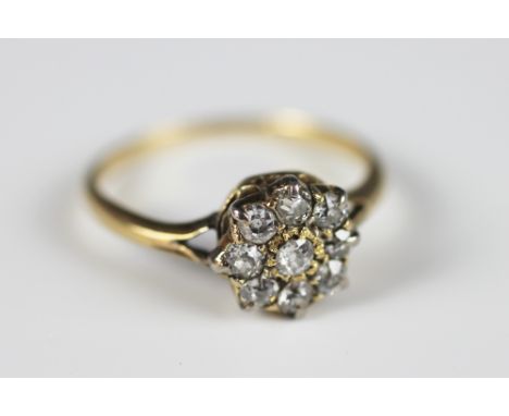 A diamond set cluster ring, the nine stone diamond cluster of old brilliant cut diamonds all claw set in yellow gold, to the 