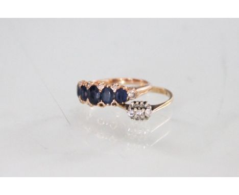 A seven stone sapphire and diamond ring, the five graduated, oval sapphires, terminated by two diamonds and further intersper