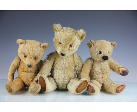 A Chiltern Hugmee teddy pear, with gold plush and velvet pads, lacking label, 43cm, a post-war gold mohair teddy bear, 37cm a