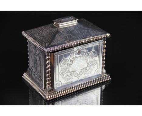 A Victorian silver tea caddy Joseph Angell II, London 1855, of casket form, with chased floral and foliate decoration and bar