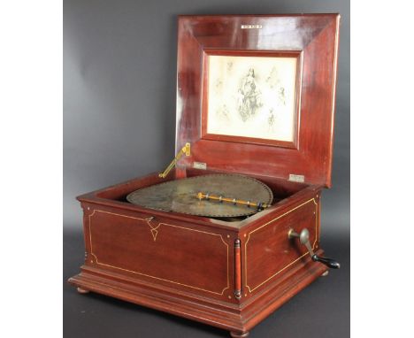 A late Victorian Regina inlaid mahogany music box, playing 40cm discs on two opposing combes, the underside of the lid with o