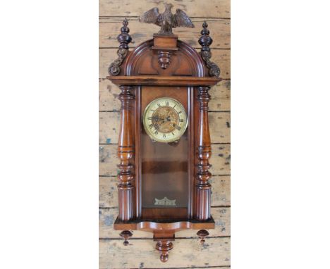 A late 19th century beech and walnut Vienna regulator Roman numeral chapter ring with floral center, 77cm (at fault)