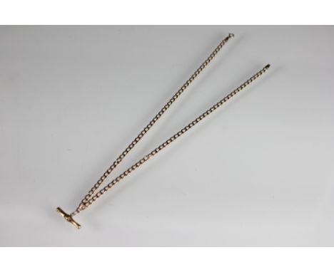 A 9ct yellow gold decorative chain suspending central T bar, the uniform flattened curb link chain with bolt ring clasp, weig
