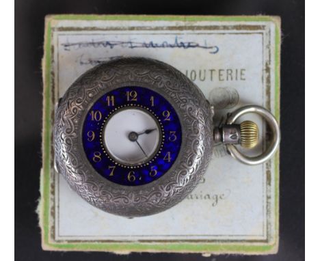 A Victorian lady's silver fob watch and chain, the half hunter watch London 1884, the florally engraved case with blue enamel